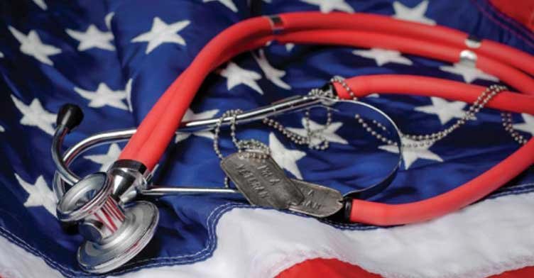 United States of American flag draped beneath a doctor's stethoscope