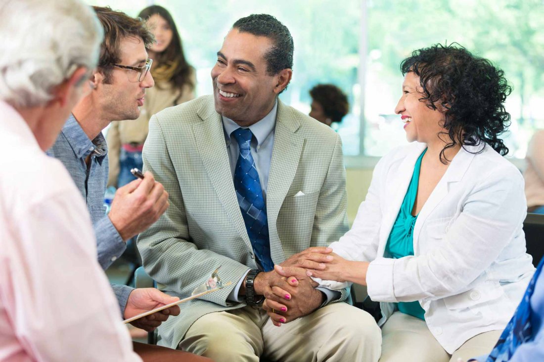 image of diverse couple in a support group meeting