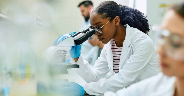 young African American female doctor studying in a lab