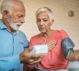 elderly couple checking blood pressure