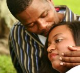 african-american couple comforting each other